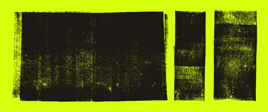 Grunge linocut stamp textures set on bright yellow-green background. Ink rollers, black smudges.