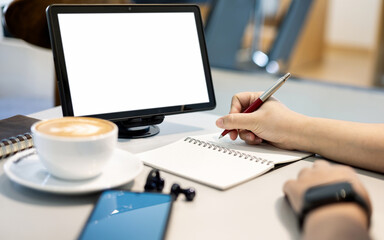 close up shot, young asian woman taking note and working or study online with tablet computer