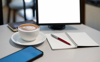 open notebook and pen for taking note with latte coffee and tablet, mobile on desk, concept for online working or study