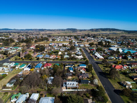 sunlit townscape of Glen Innes on late winter morning with houses lining intersecting streets