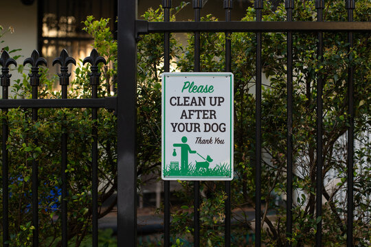 please clean up after your dog sign on fence