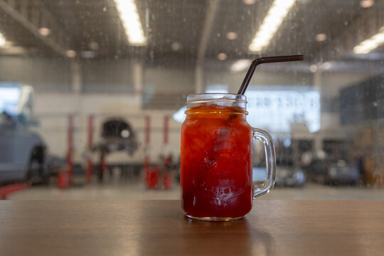 Iced Red Drink in Mason Jar with Straw, Iced black tea