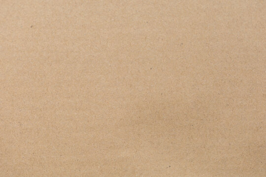 Close up of Old brown paper texture  visible. Paper fibers suitable for use as background images or decorations