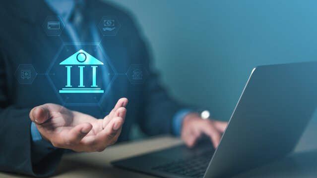 banking, finance, loan, credit, interest, fintech, deposit, Businessman using laptop with digital banking icon, representing online finance, fintech service, and secure transaction.