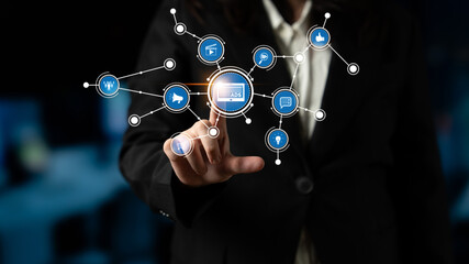 A business professional engages with a digital network, showcasing the interaction between technology and communication in a modern corporate setting. Tessel