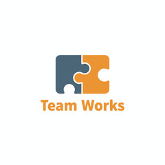 A logo featuring two interconnected puzzle pieces, one blue and one orange, and accompanying text