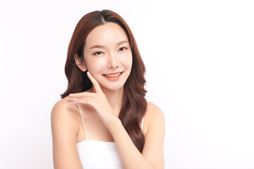 A beautiful young Asian woman with clean, fresh skin against a white background. Skincare, facial treatment, cosmetology, beauty, and spa. An elegant portrait of an Asian woman.