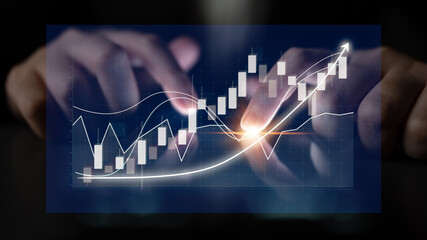 Visual representation of hands interacting with financial charts, showcasing stock market trends...