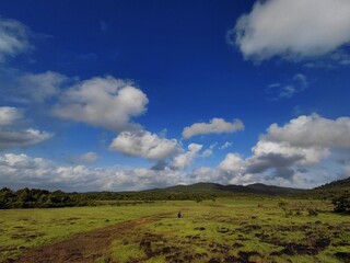 Fototapeta premium landscape with blue sky in Goa, clouds over the mountains, grassland, sunny day in Goa.