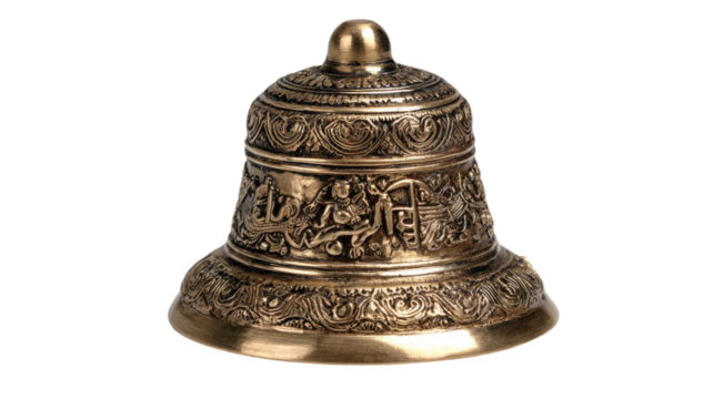 Antique brass handbell isolated on white with a vintage patina