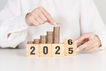 2025 end year to Happy New Year 2026 with Coins stack. Money, Budget, tax, investment, financial, savings and New Year Resolution concepts