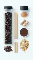 A top-down view of various baking ingredients, including chocolate balls in a container, oats, cocoa powder, and nuts, arranged neatly.