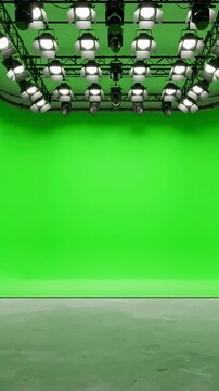 Wide angle shot of a clean, empty studio with seamless green screen cyc wall extending from floor to ceiling the perfect backdrop for any or chroma key video production loop distortion, overlay