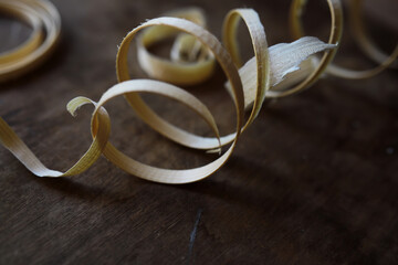 Plane jointer carpenter or joiner tool and wood shavings. Woodworking tools on wooden table. Carpentry workshop