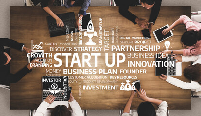 A dynamic overhead view of a collaborative business meeting focused on startup strategies, innovation, and planning. Ideal for marketing and entrepreneurial themes. Tessel