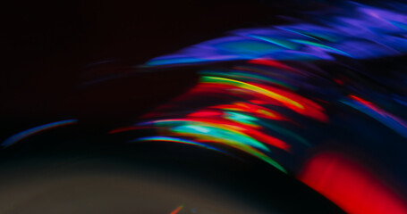 Flare swirl blur. Round glow. Blue green red light circle flow on abstract background. Bright color flash arch on black free space.