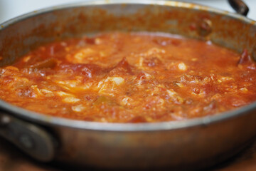 closeup of turkish menemen in a steel pot 