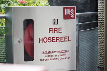 Fire hose reel instructions located in a public space