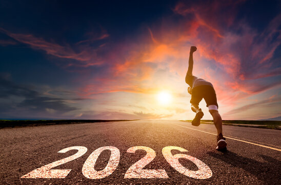 Happy new year 2026 concept.man running and sprinting on road with sunset background