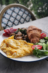Delicious breakfast spread on a sunny patio table