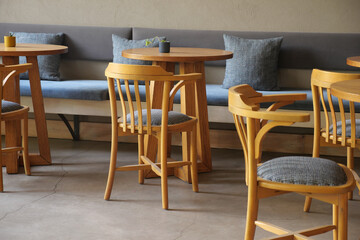 Modern cafe interior with wooden furniture and cozy setting