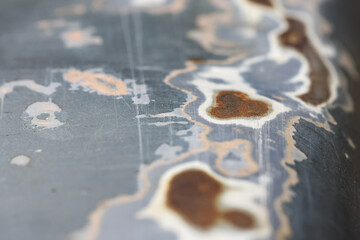 Naklejka premium Melancholic abstract background showing rust and corrosion on an old metal surface. industrial texture reveals slow process of decay and weathering over time