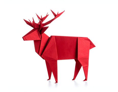 A vibrant red origami deer sculpture, skillfully folded from paper, displaying majestic antlers and intricate details, standing elegantly against a pristine white background - Powered by Adobe