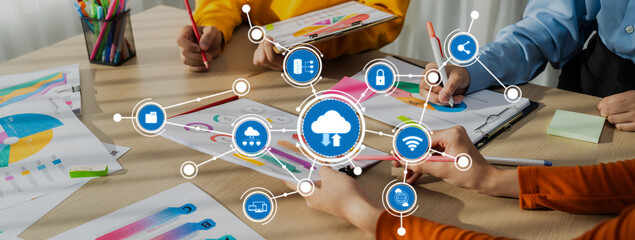 A dynamic scene depicting a collaborative work environment where a team engages in cloud computing concepts with colorful data visualizations and creative brainstorming activities. Amity