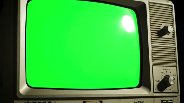 Green Screen close up footage of a dated tv set with mock chroma key template display nostalgic retro nineties technology concept scene 3 distortion, overlay, glitch, static noise, scan lines on black