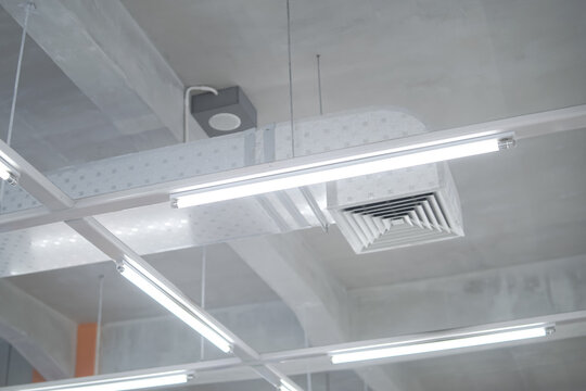 Modern Ceiling with Fluorescent Lights and Industrial Air Ducts