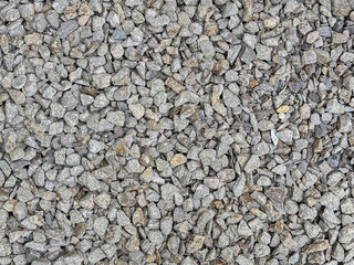Obraz premium Overhead View of Grey Crushed Stone Gravel as a Natural Background