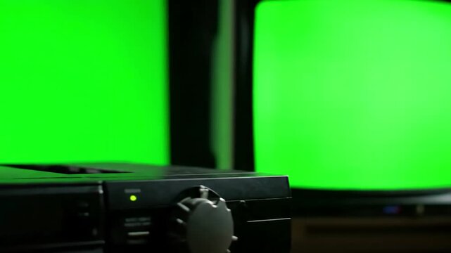 Green Screen male hand inserting a vhs into vcr and an old tv you can replace with the footage or picture want do it lkeyingr effect in after effects scene 3 distortion, overlay, glitch, static noise