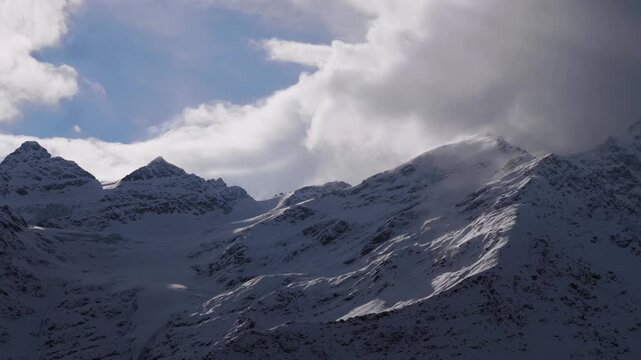 A majestic and dramatic view of the snow capped peaks of Mount Elbrus, the highest mountain in Russia and Europe, located in the North Caucasus region.
