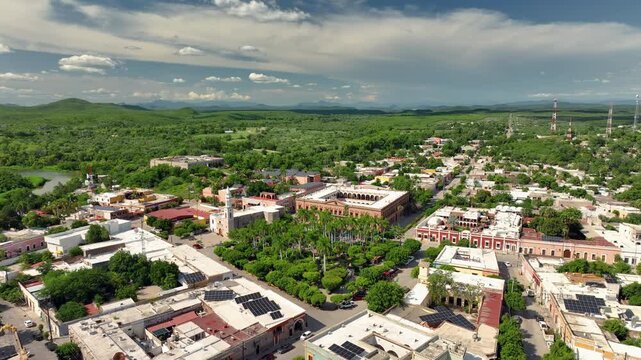 Panoramic drone shot circling downtown El Fuerte, sunny day in Sinaloa, Mexico