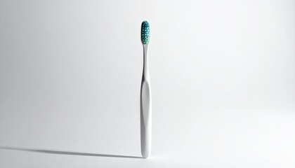 White toothbrush, blue bristles, single shadow on white