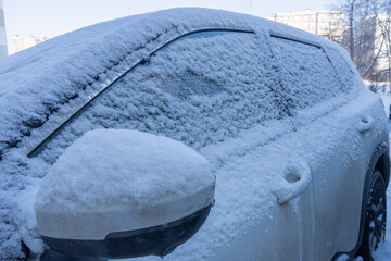 A car in the snow early in the morning