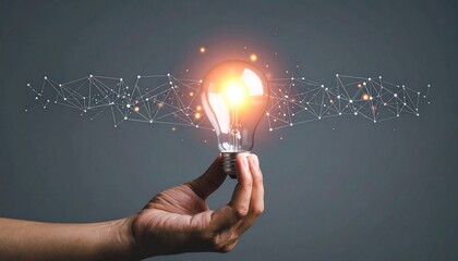 Hand holding glowing light bulb with digital network elements on dark background, symbolizing tech innovation and bright ideas.