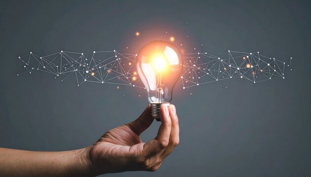 Hand holding glowing light bulb with digital network elements on dark background, symbolizing tech innovation and bright ideas.