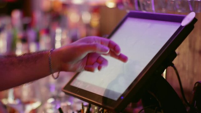 Bartender cash register. Cafe touch screen. Hand preparing bill at desk. Male worker using modern computer on bar counter choosing option.
