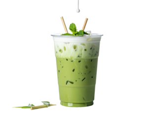 Iced green tea beverage with milk froth, mint, straws, ice, and a black background