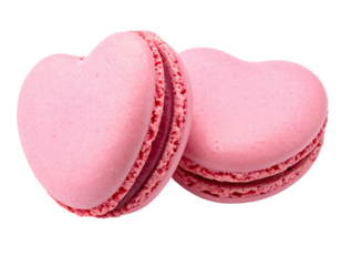 Two pink heart-shaped pastries with cream filling, isolated on black background