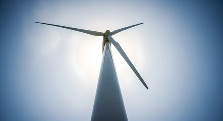 Renewable Wind Energy Turbine on Hilltop Against Blue Sky