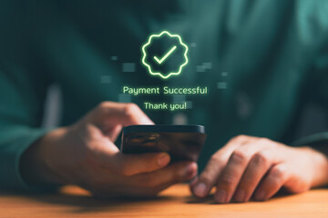 Person holding smartphone with digital confirmation message “Payment Successful,” representing online transaction, mobile banking, e-commerce payment, fintech technology, and secure financial service.
