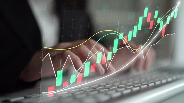 An image showing hands typing on a keyboard, complemented by a stock market graph overlay, represents essential concepts in finance and data analysis for businesses. Copula