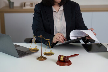 Lawyer Organizing Legal Documents at Office Desk