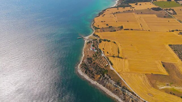 Seddulbahir, Eceabat, Turkey. Panoramic aerial view of Helles Memorial obelisk and Mehmetcik Feneri lighthouse with Aegean Sea and Dardanelles Strait on clear day. Aerial View