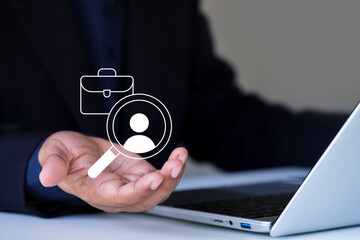 Job search recruitment hiring concept, magnifying glass profile and business hand, human resources professional analyzing candidate on laptop computer, HR modern technology, virtual job search icon