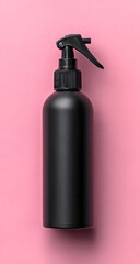 Stylish black spray bottle on a vibrant pink background, perfect for personal care or hair products.