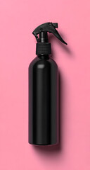 Stylish black spray bottle on a vibrant pink background, ideal for cleaning products or personal care items.