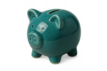 Piggy bank in teal ceramic symbolizing saving money and wealth management with an open slot for coins